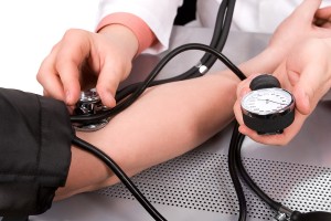 bigstock-doctor-checking-blood-pressure-17566802